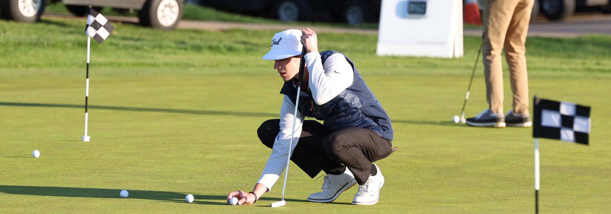 Golfer Lining Up Putts